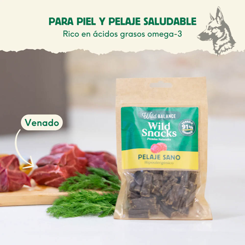 Un paquete de Wild Snacks Pelaje Sano de Venado en una cocina, junto a un corte de carne de venado fresco y ramas de eneldo. El 